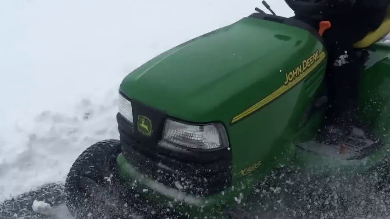 John Deere Tractor X585 Plowing Snow