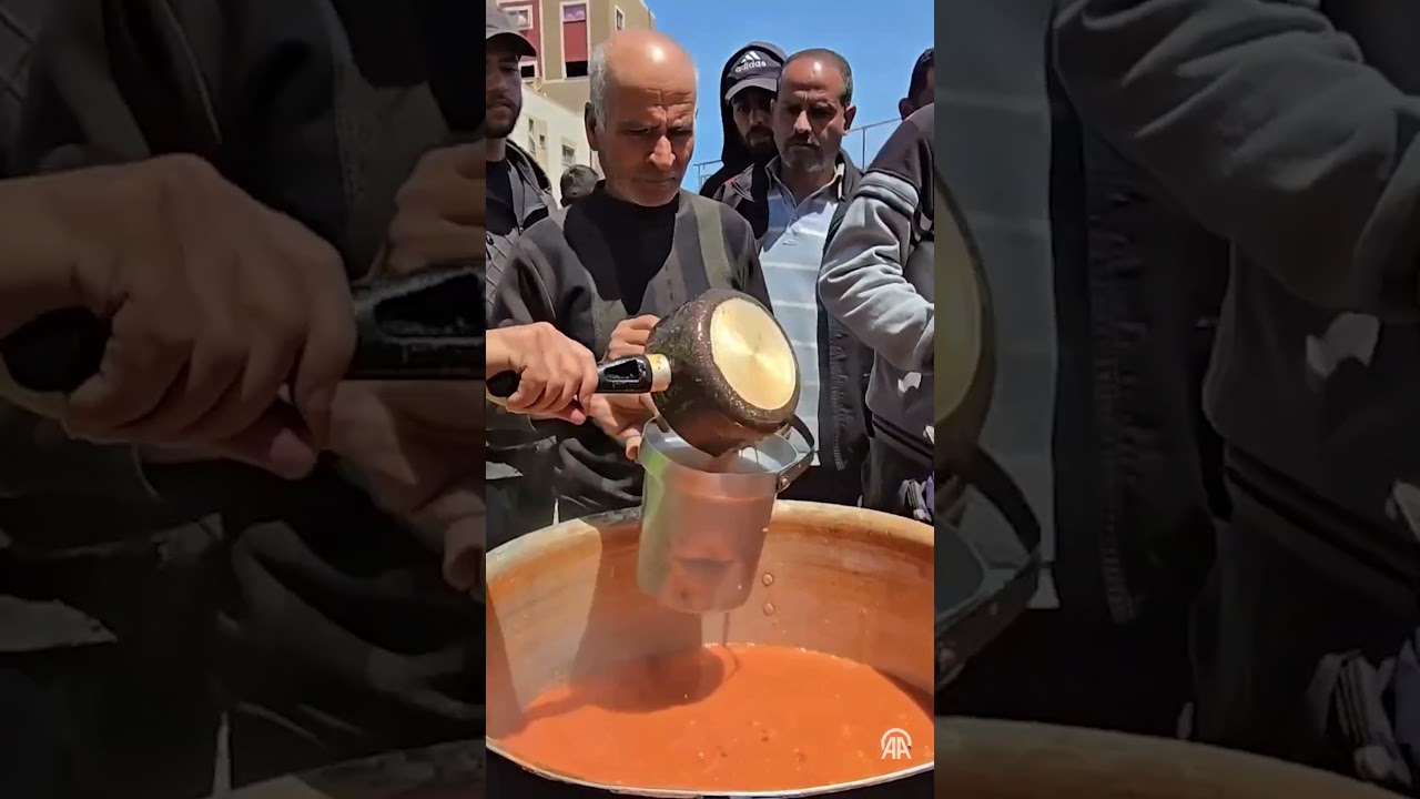 Charitable organizations distribute hot meals to Palestinians in Nuseirat Refugee Camp
