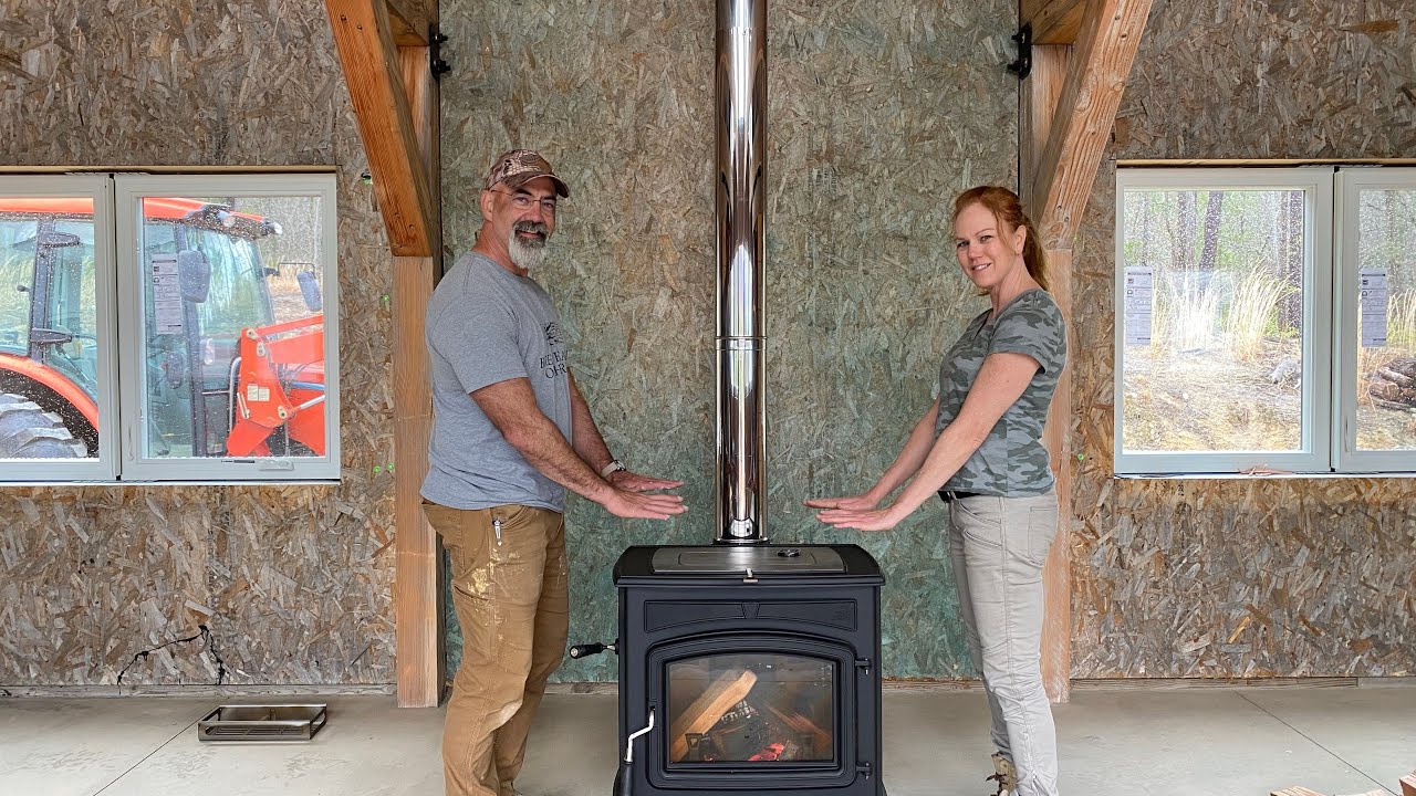 Our First Fire. Breaking in the new wood stove on a rainy day.  DIY SIPs home build #130