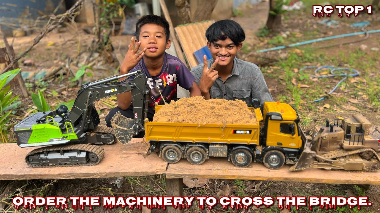 R/C #vdo32 - They are transporting soil to build a road across a long bridge.