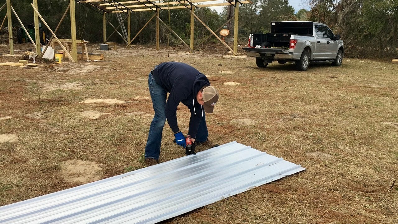 Pole barn kit: How to install metal roofing straight.