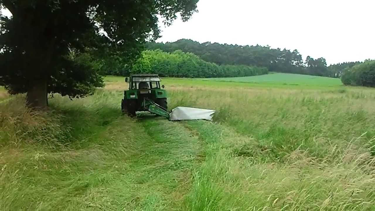 Fendt 106 LS am Graßmähen mit Kuhn GMD 55 Select 1