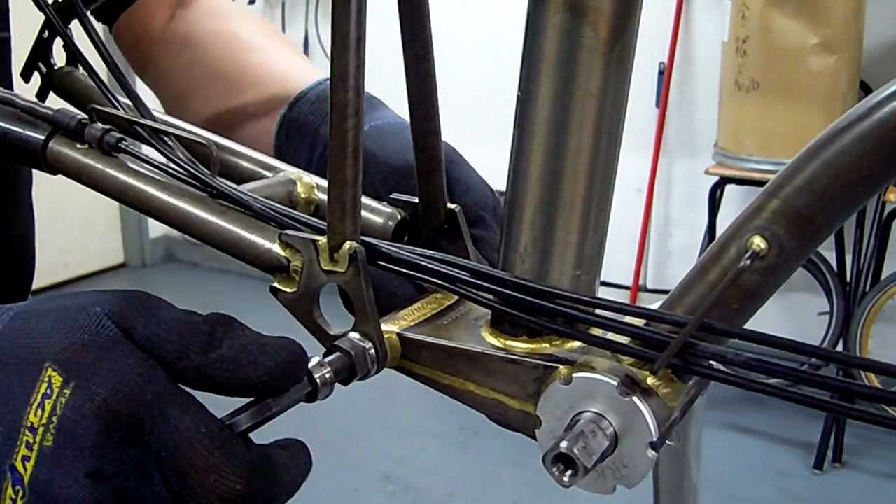 Brompton for titanium parts: Titanium Rear hinge bush and spindle.