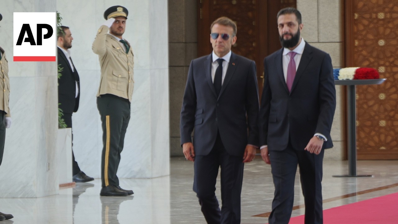Explosions rock Damascus as Macron visits Syria