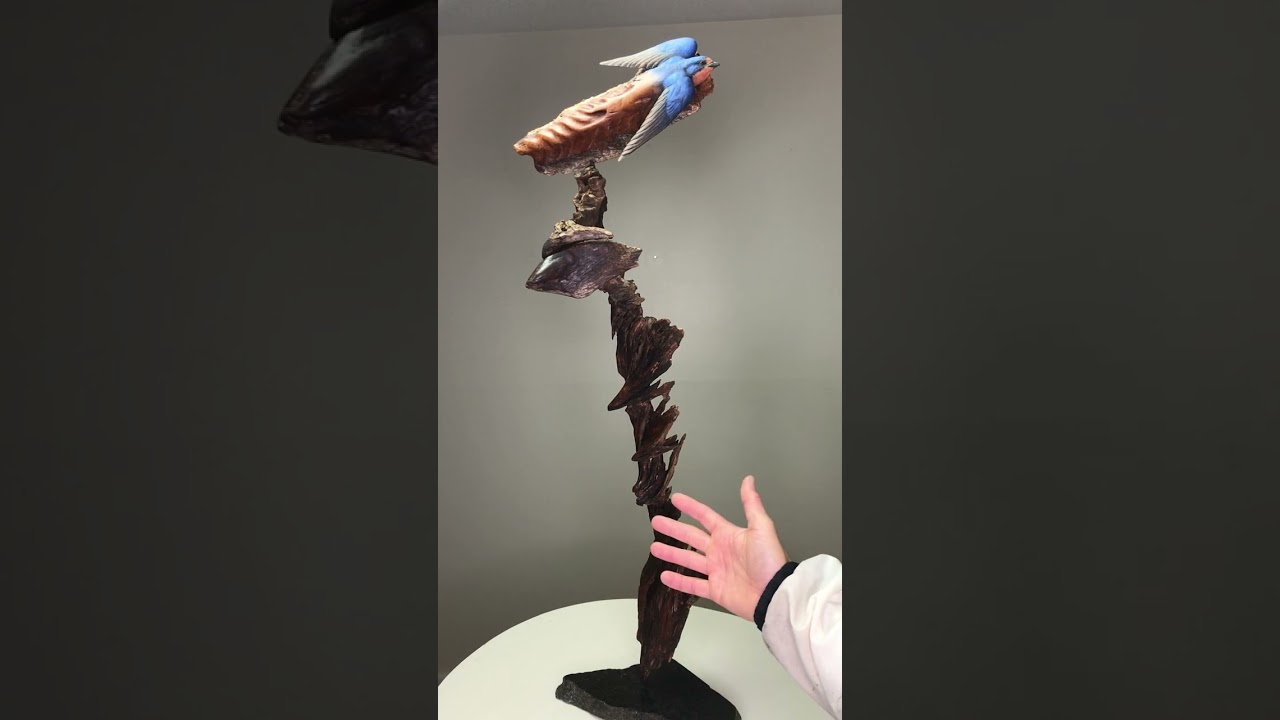 Emerging Birds Carved From Bark