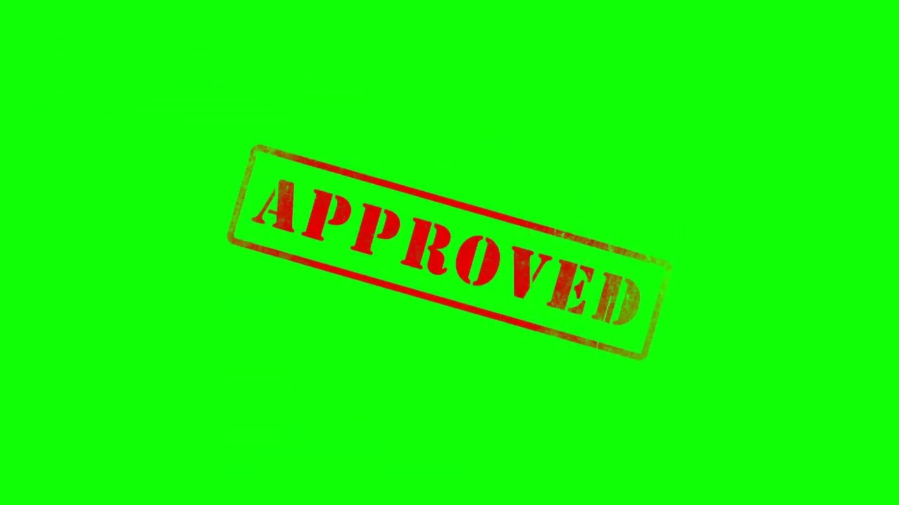 approved being stamped on green screen with alpha channel