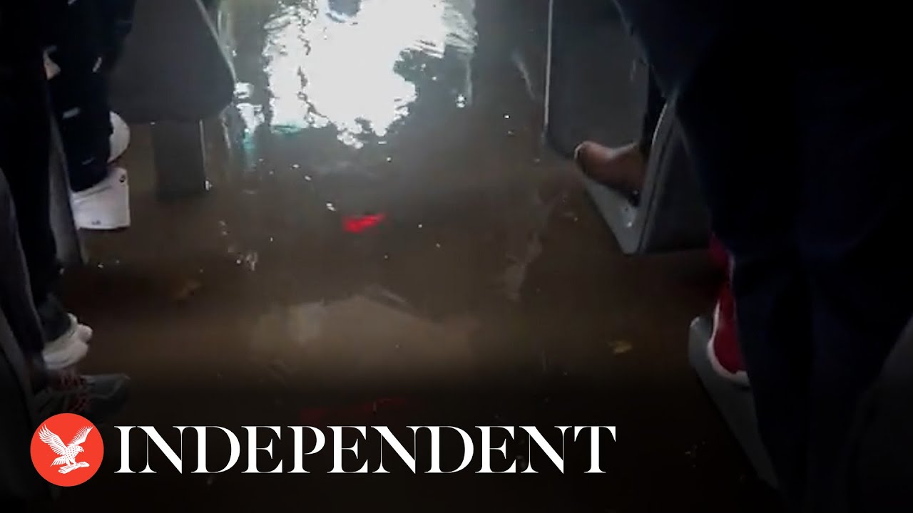 New York City subway and buses fill with water as flash flood wreaks havoc