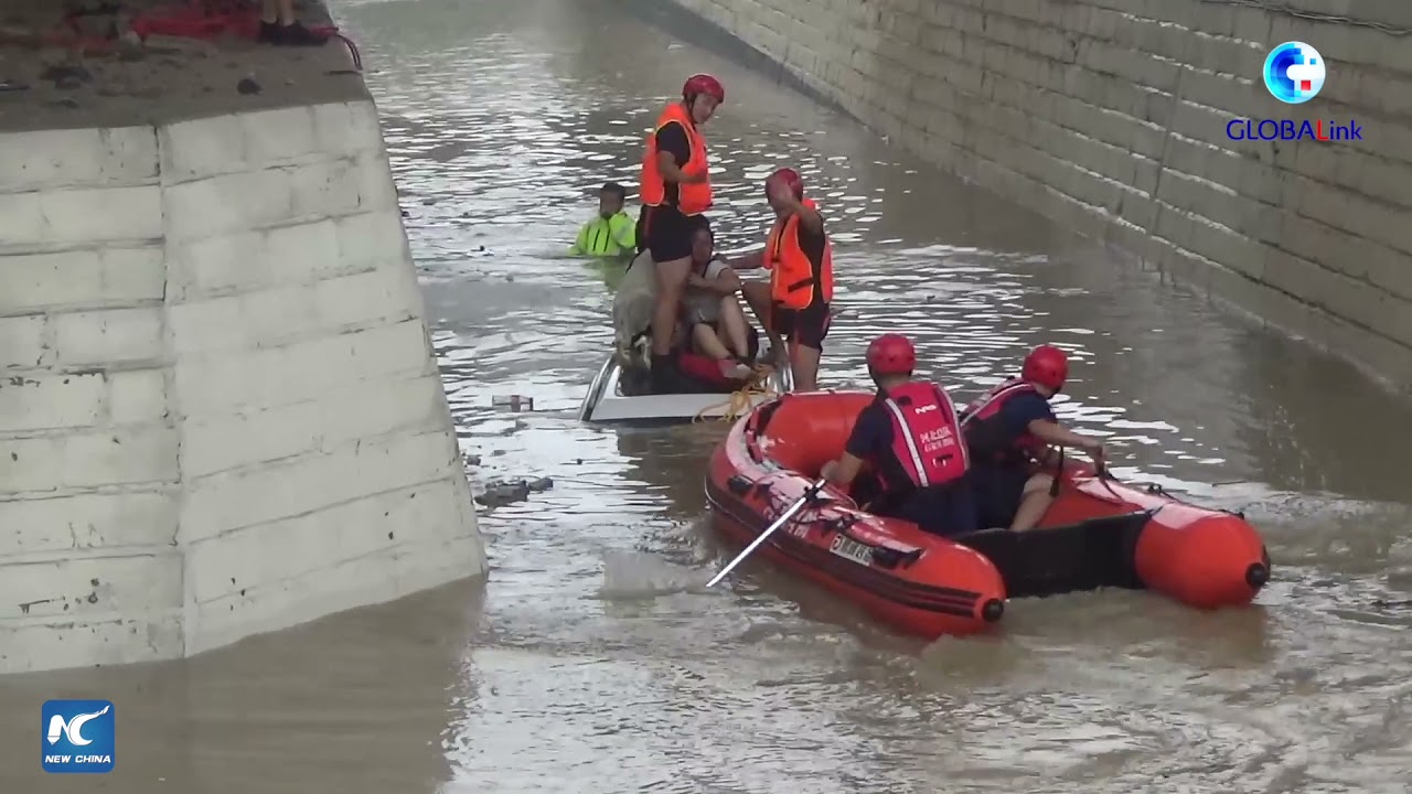 GLOBALink | Firefighters in north China rescue four trapped in submerged car