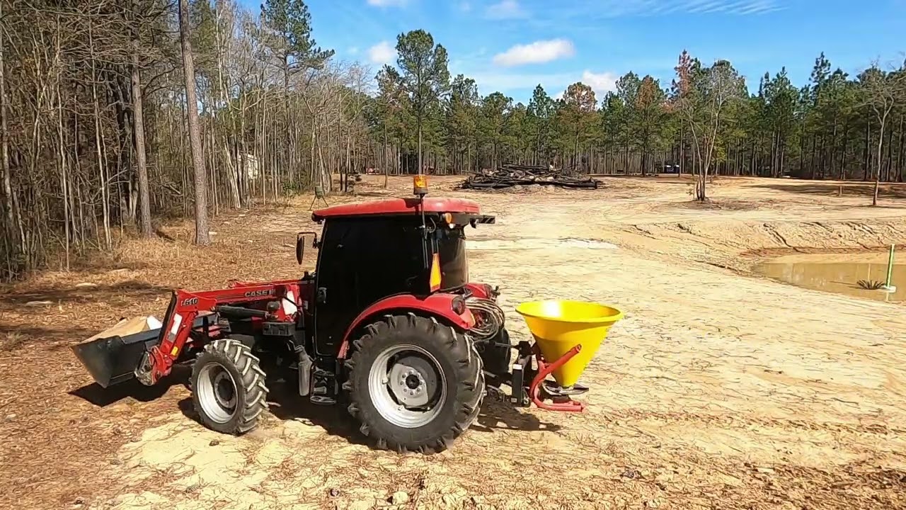 Planting grass seeds over to the lake site.