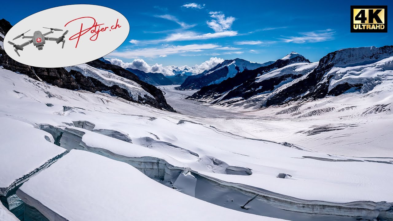 Jungfraujoch - Top of Europe and Aletsch Glacier UNESCO Heritage Site 4k Switzerland Aerial View