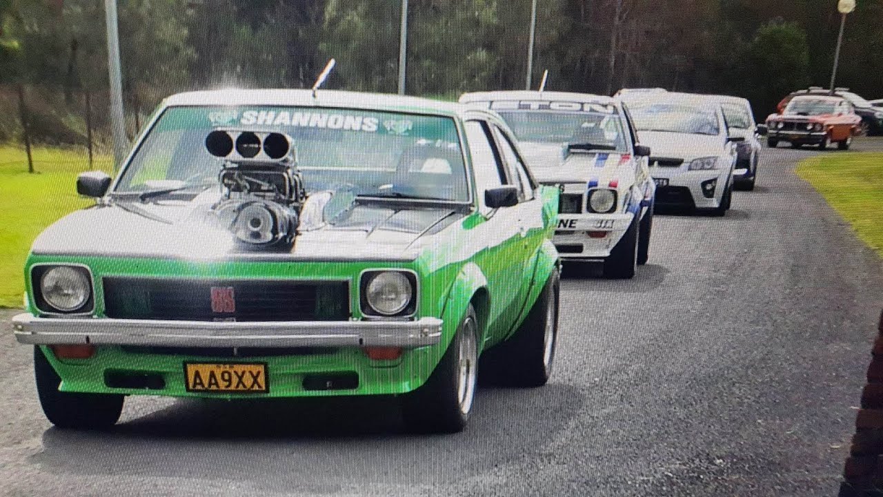 Modified cars leaving a car show accelerating Sydney, Luddenham