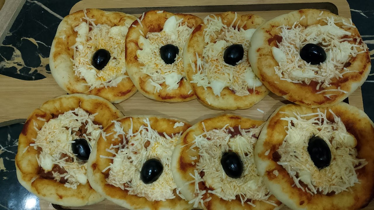 اسهل وانجح ميني بيتزا 🍕 رح ديري بيها حالة في هذا رمضان بعجينة خفيفة وتجي قطنية 🥰