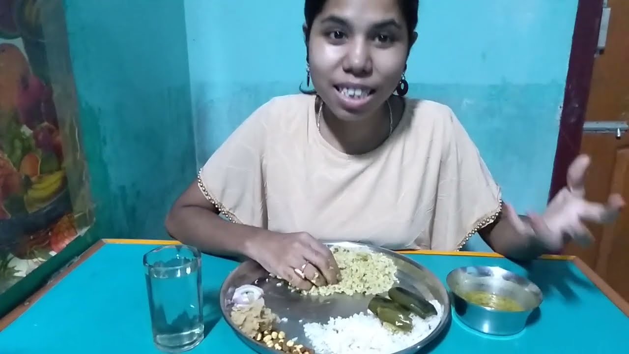 Eating Veg Food Dal Chawal, Bhaji, Aloo bhorta, Roasted chickpea and onion slice