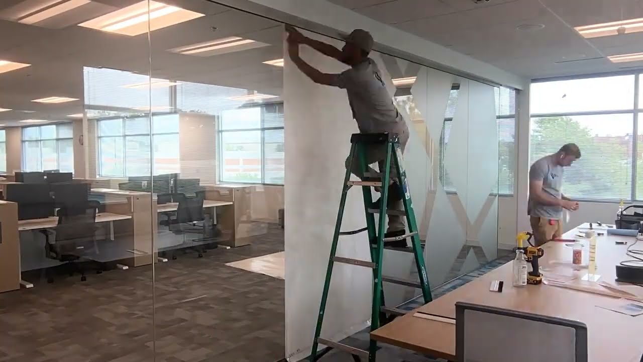 Installing Frosted Vinyl Graphics to the Glass of Office Windows, Doors, and Interiors