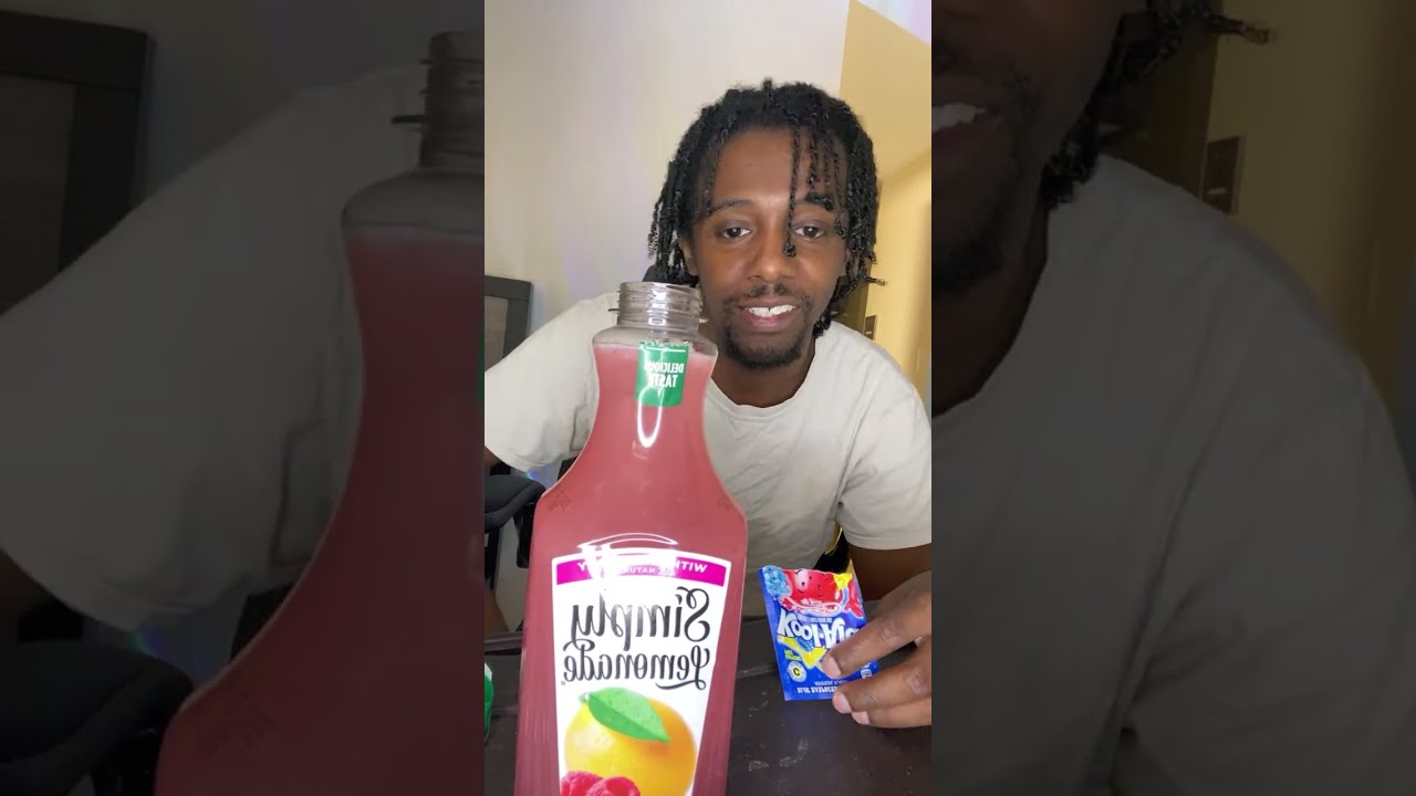 Mixing The Blue Raspberry Lemonade Kool-Aid with Simply Lemonade with raspberry.