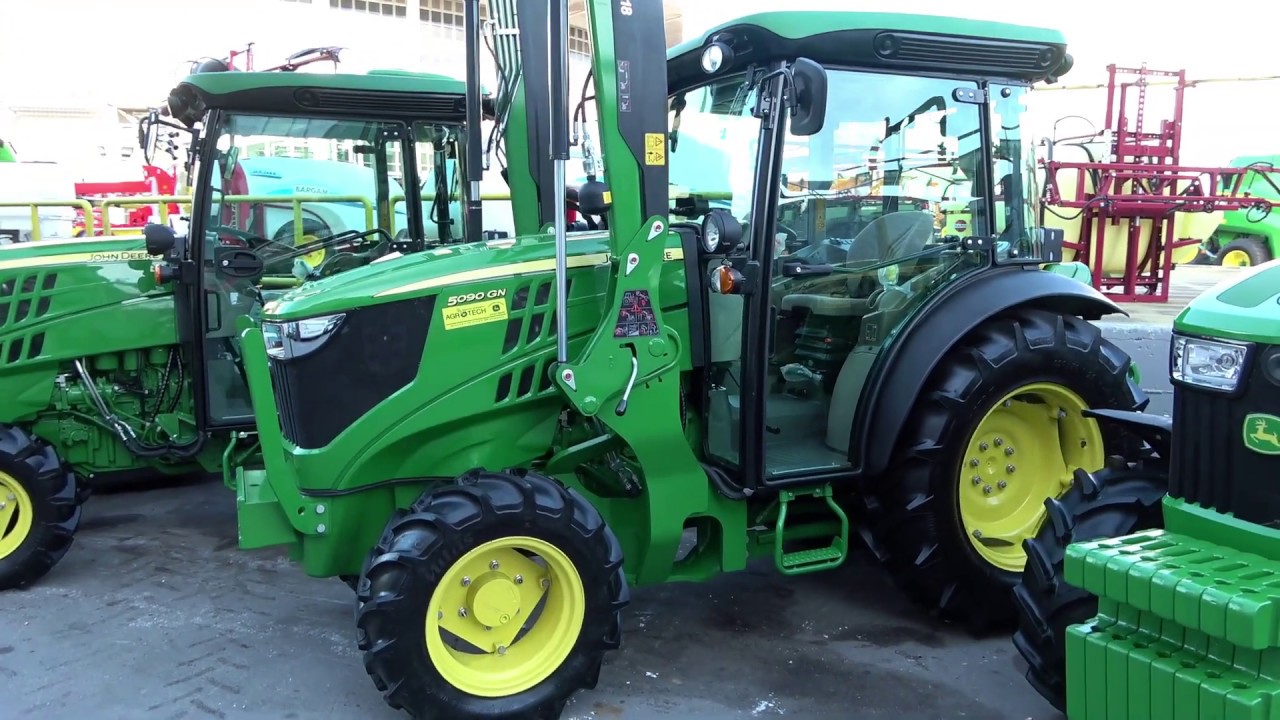 The JOHN DEERE 5090GN tractor with excavator