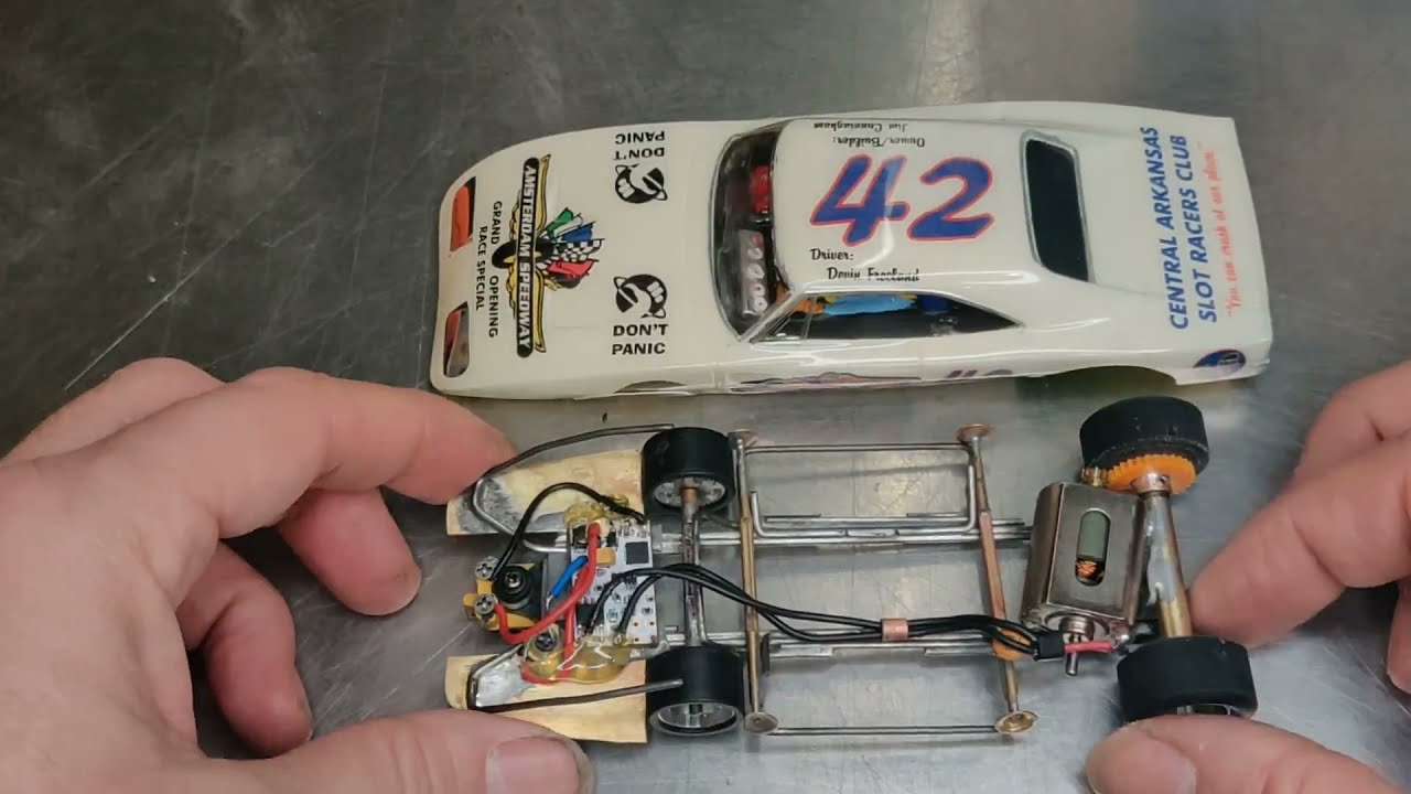 Close look at a fast handmade steel chassis car for Carrera Digital tracks.