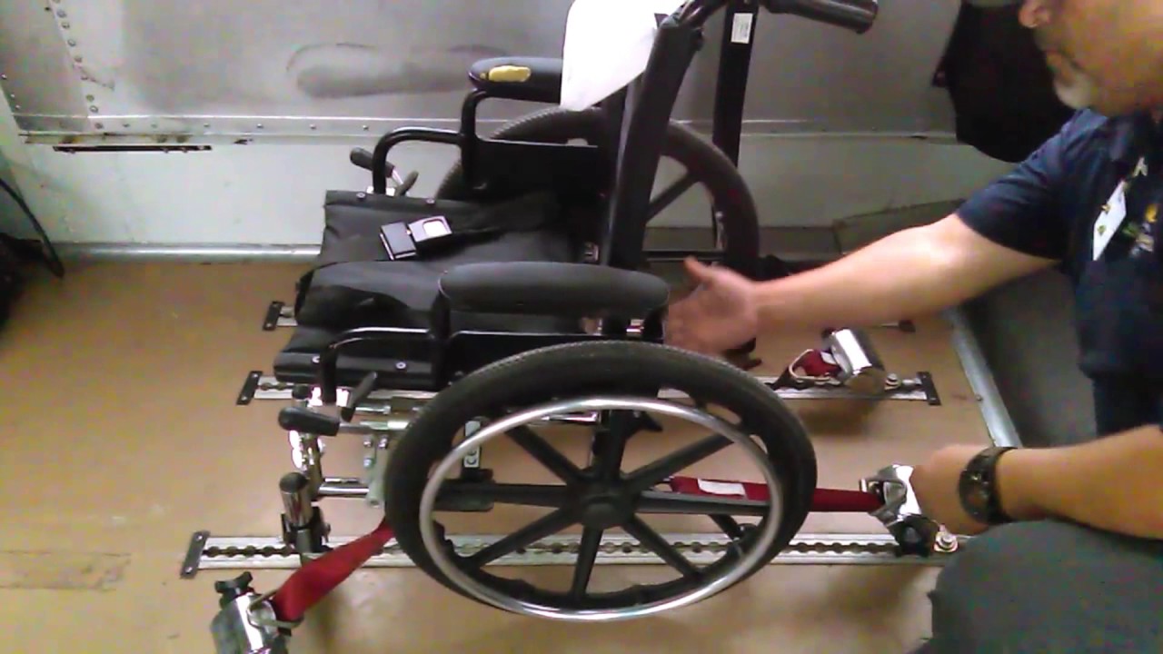 School bus wheelchair securement using  the 7-point system. CDL.