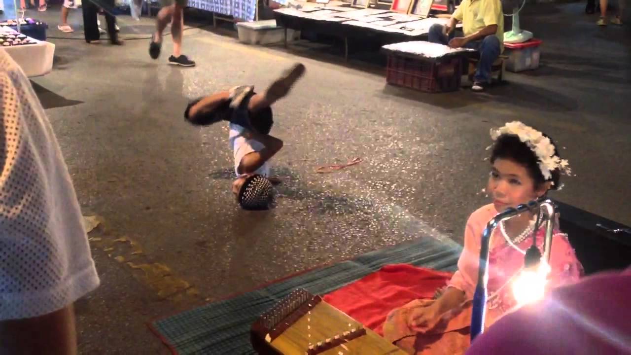 Kid Breakdancing to Chinese Hammer Dulcimer