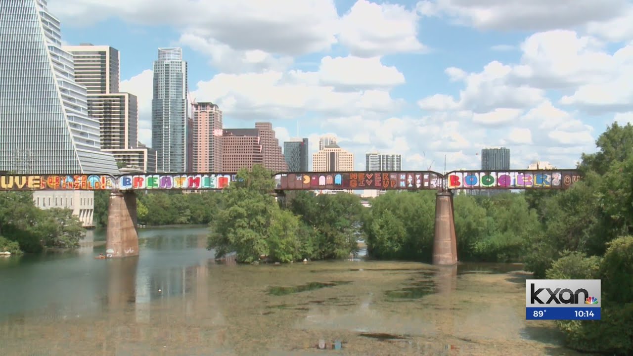 What is growing in Lady Bird Lake?