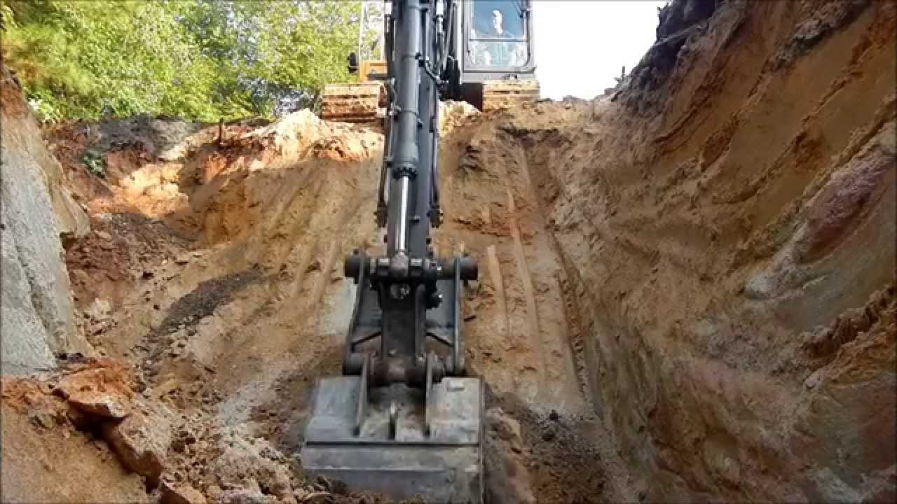 Excavator Digging A Borrow Pit