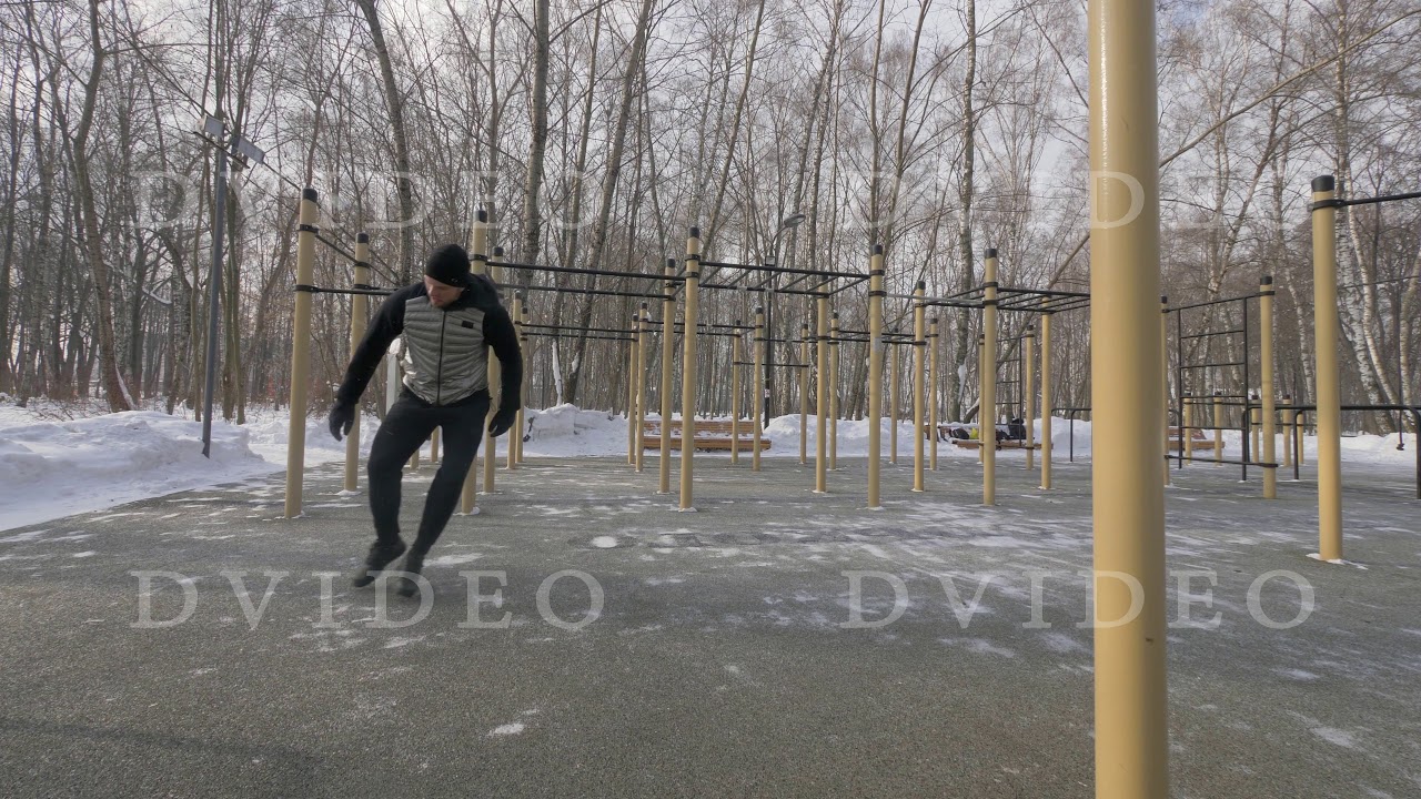 Athlete man doing fitness exercise during outdoor training at winter day