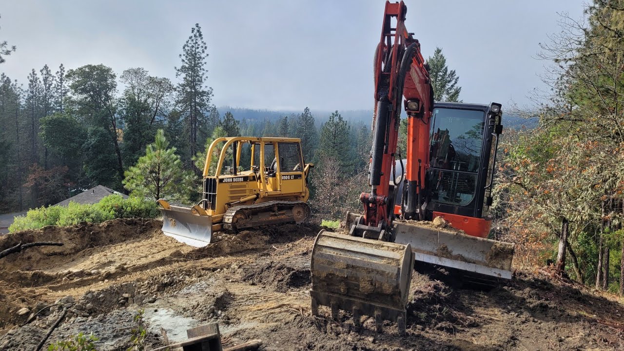 Hilltop pushing with the Kubota KX 040 4 and John Deere 450G