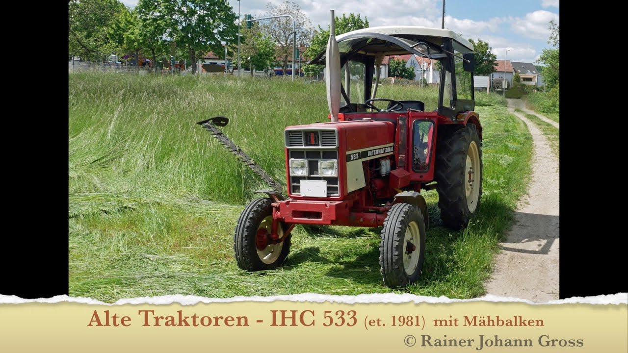 Alte Traktoren - IHC 533 (et. 1981)  mit Mähbalken (beim Grasschneiden)
