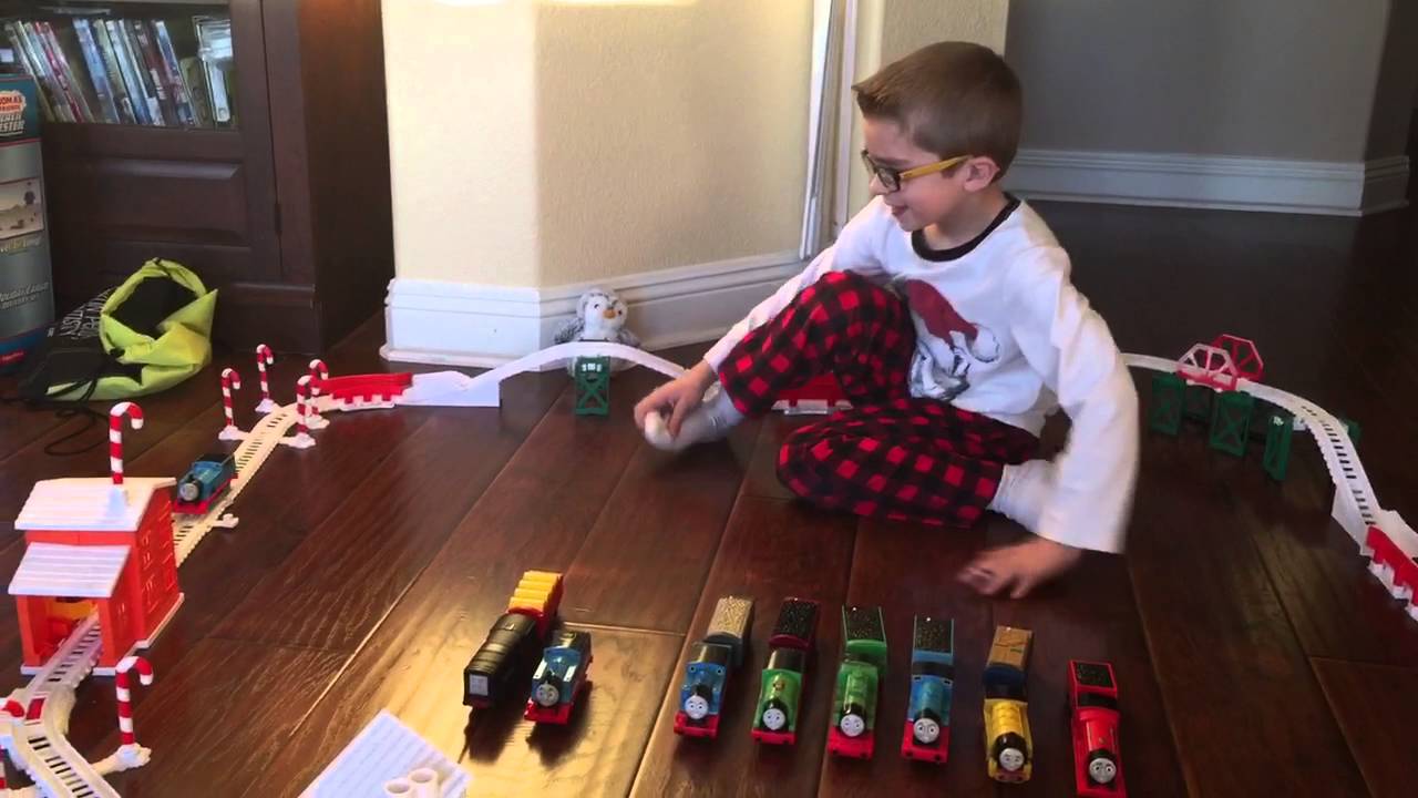 Dean plays with his talking Trackmaster trains on a new snowy track