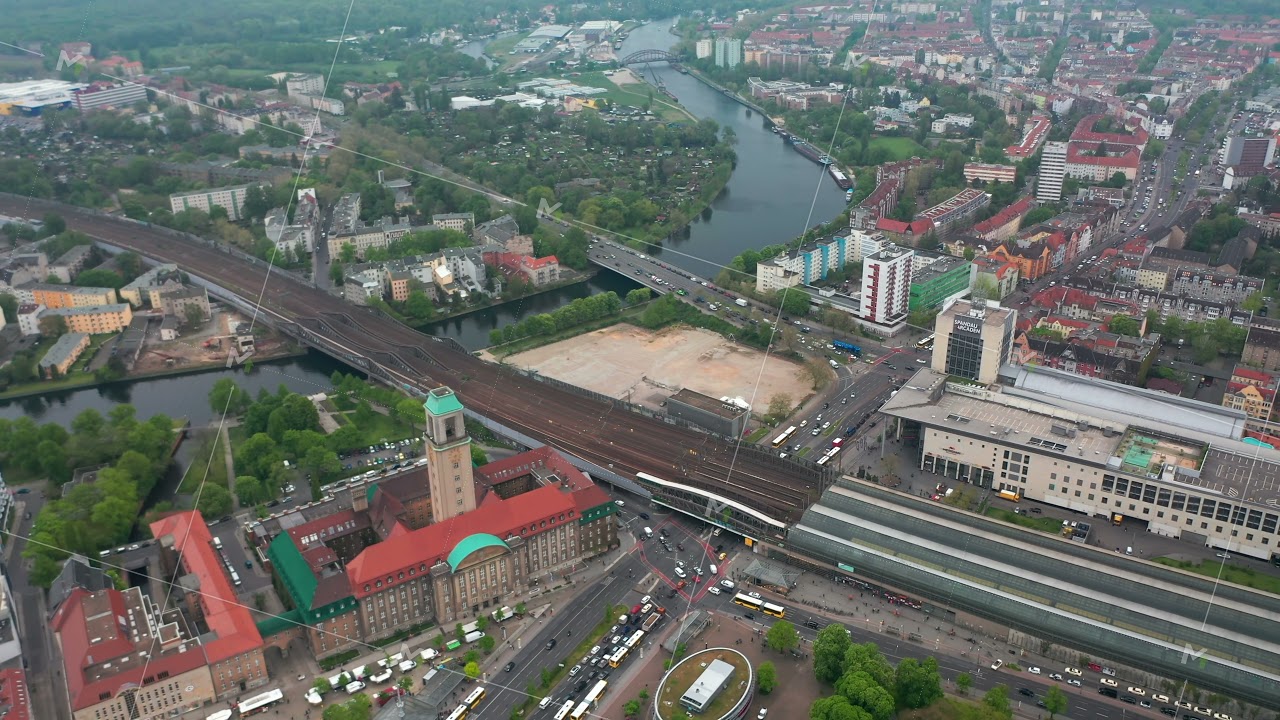 Aerial shot of Havel river flowing through town near Rathaus Spandau. High angle view of traffic