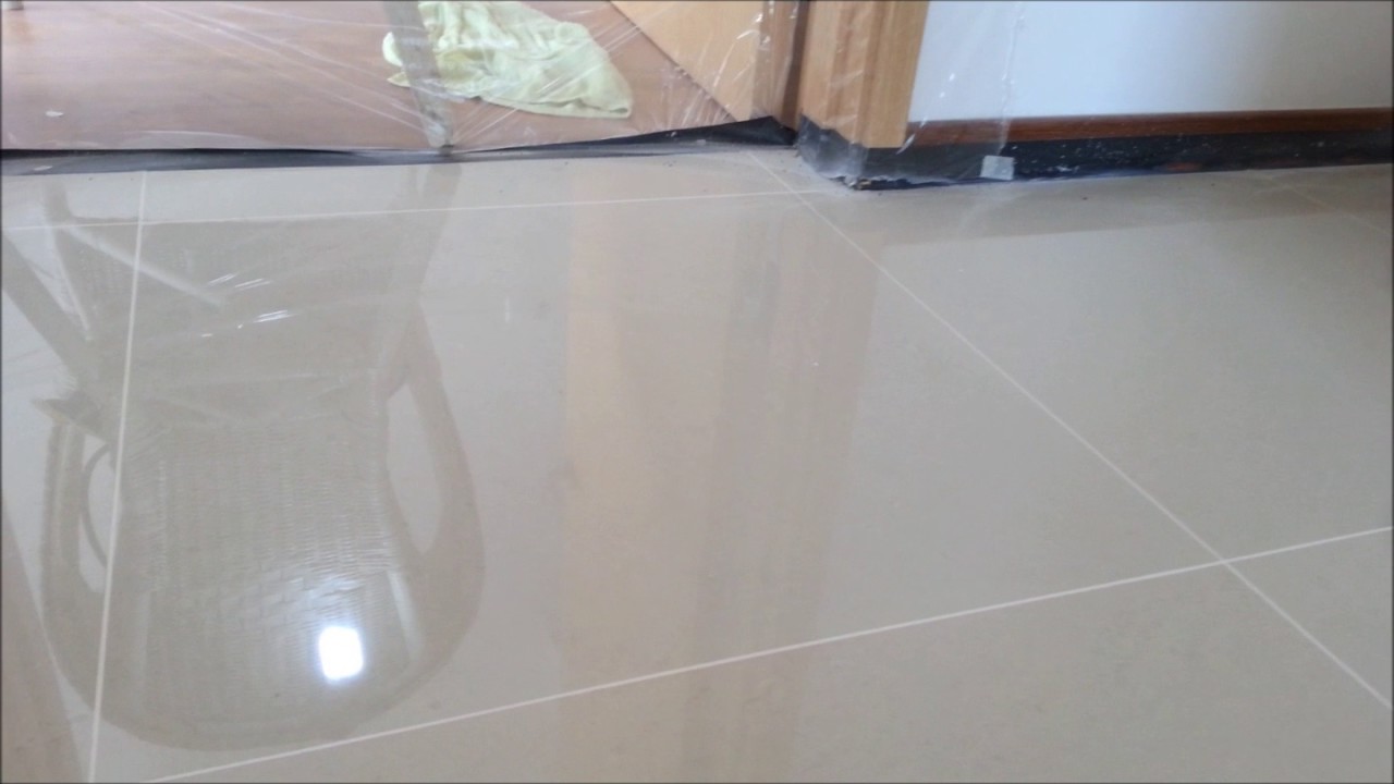 Homogeneous tile polishing with marble gum grout filled.