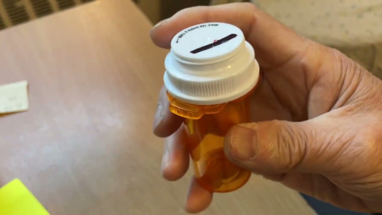Opening a tamper proof bottle with one hand