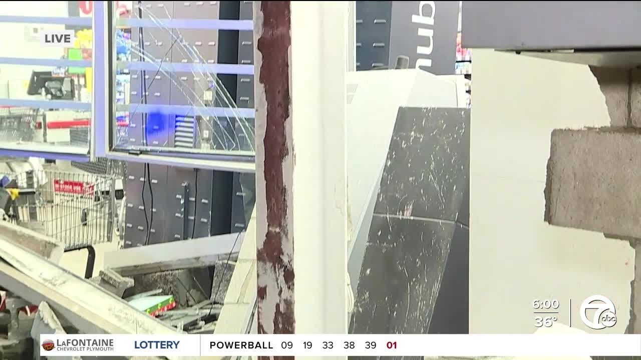 Vehicle puts hole in building on Detroit's west side