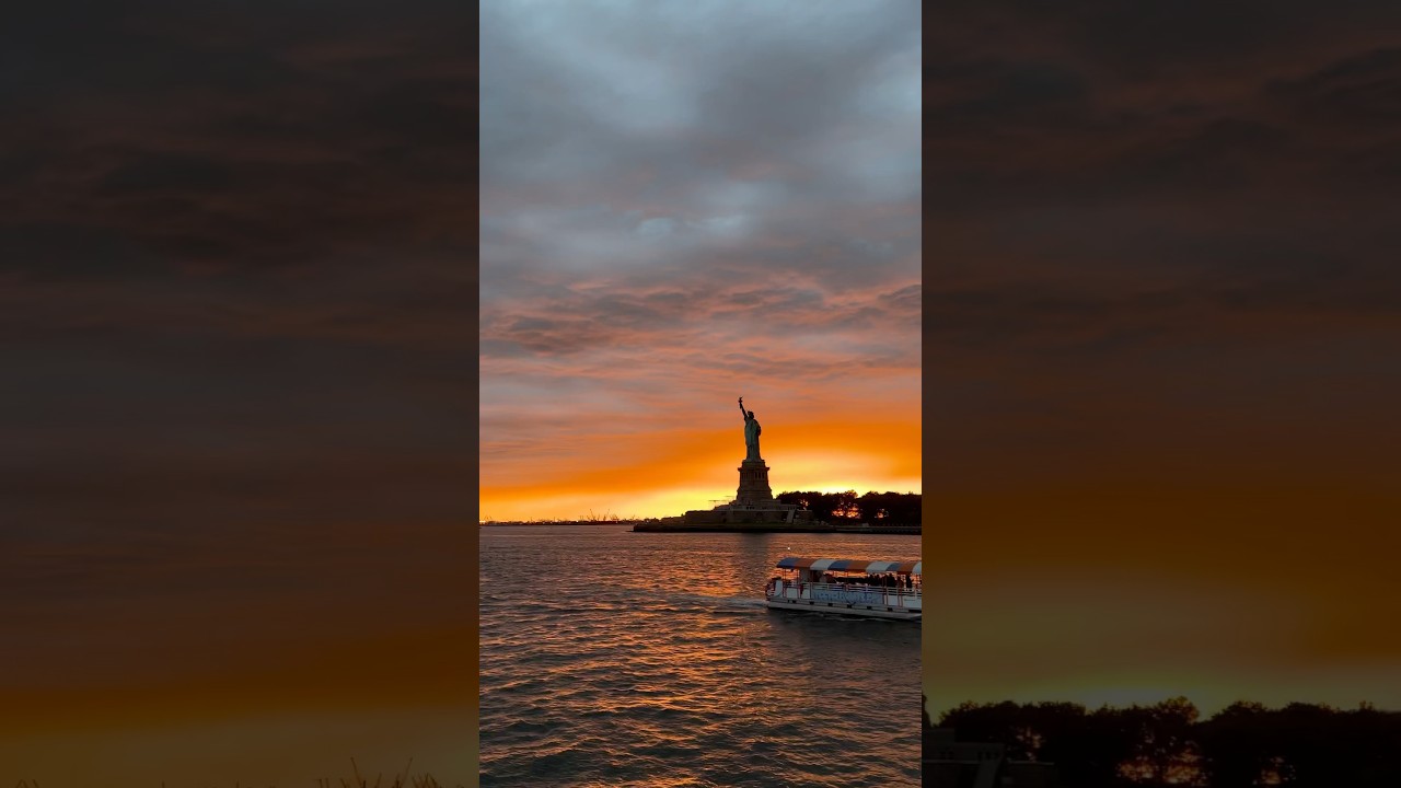 Orange sky, blue lady- NYC Statue of Liberty 2024 #cinematic #iphone #nyc #nyclandmarks