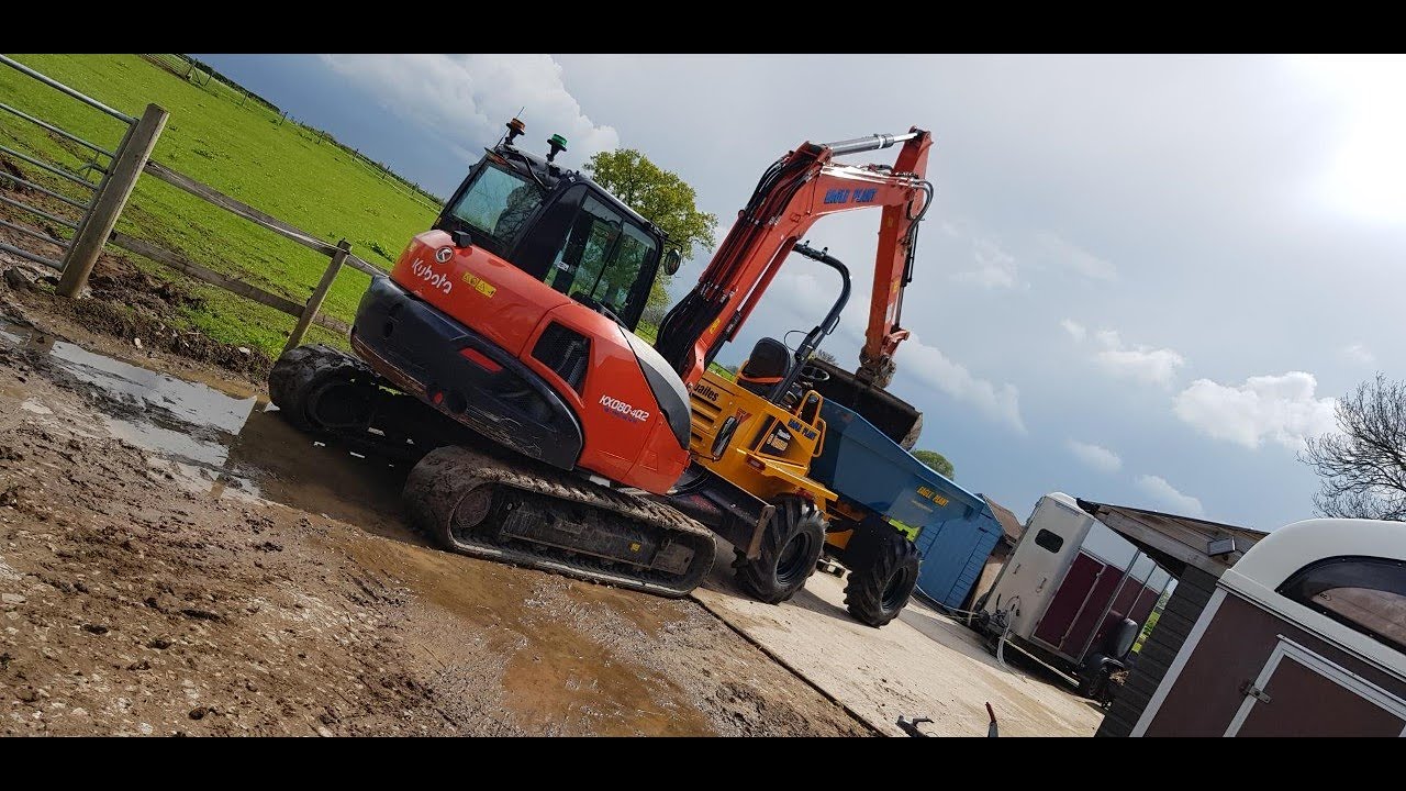 Digging out a farm track with a Kubota midi digger Excavator