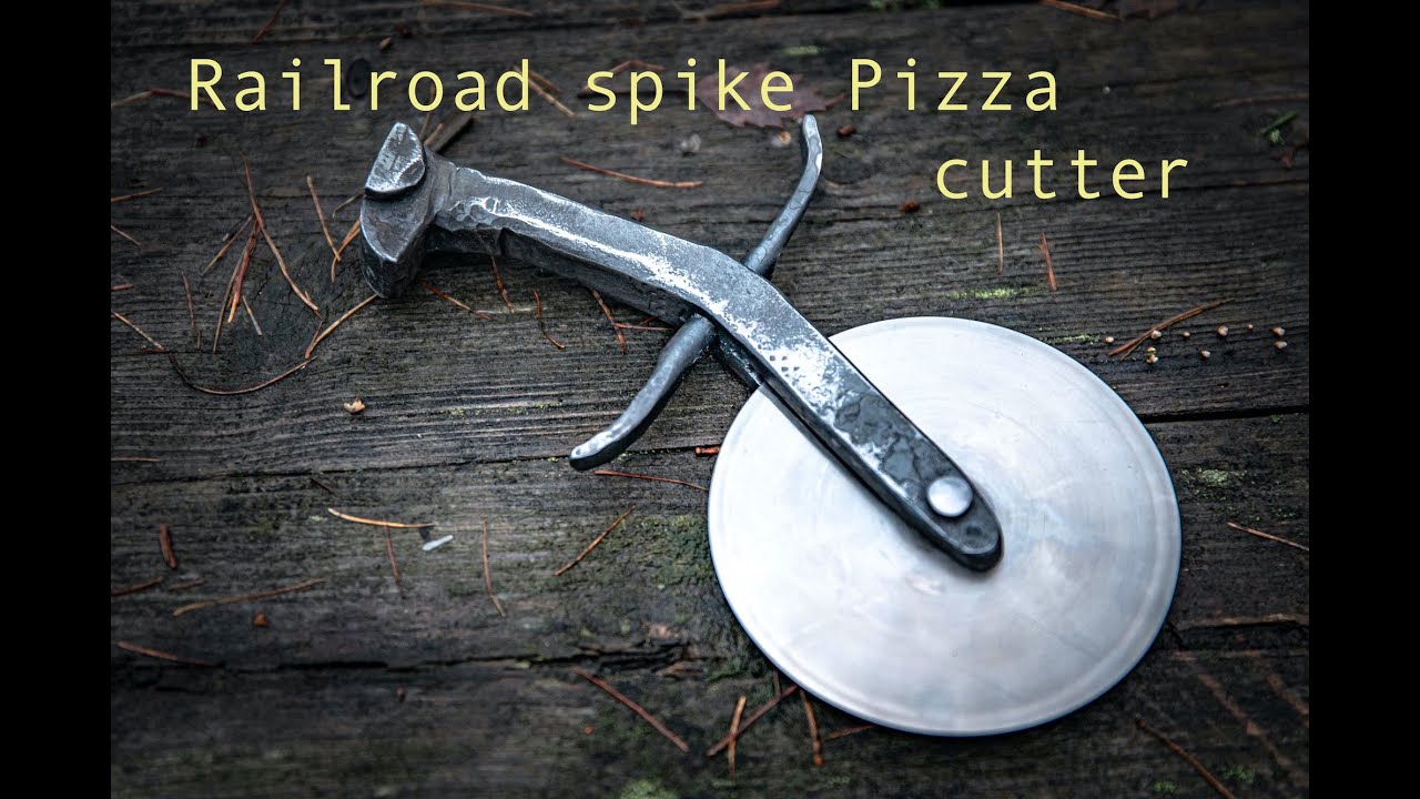 Railroad spike pizza cutter