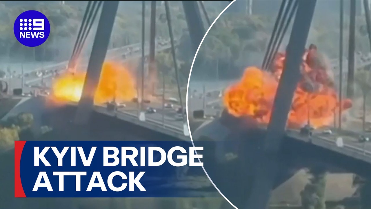 Massive fireball on Ukraine bridge sparked by Russian drone strike | 9 News Australia