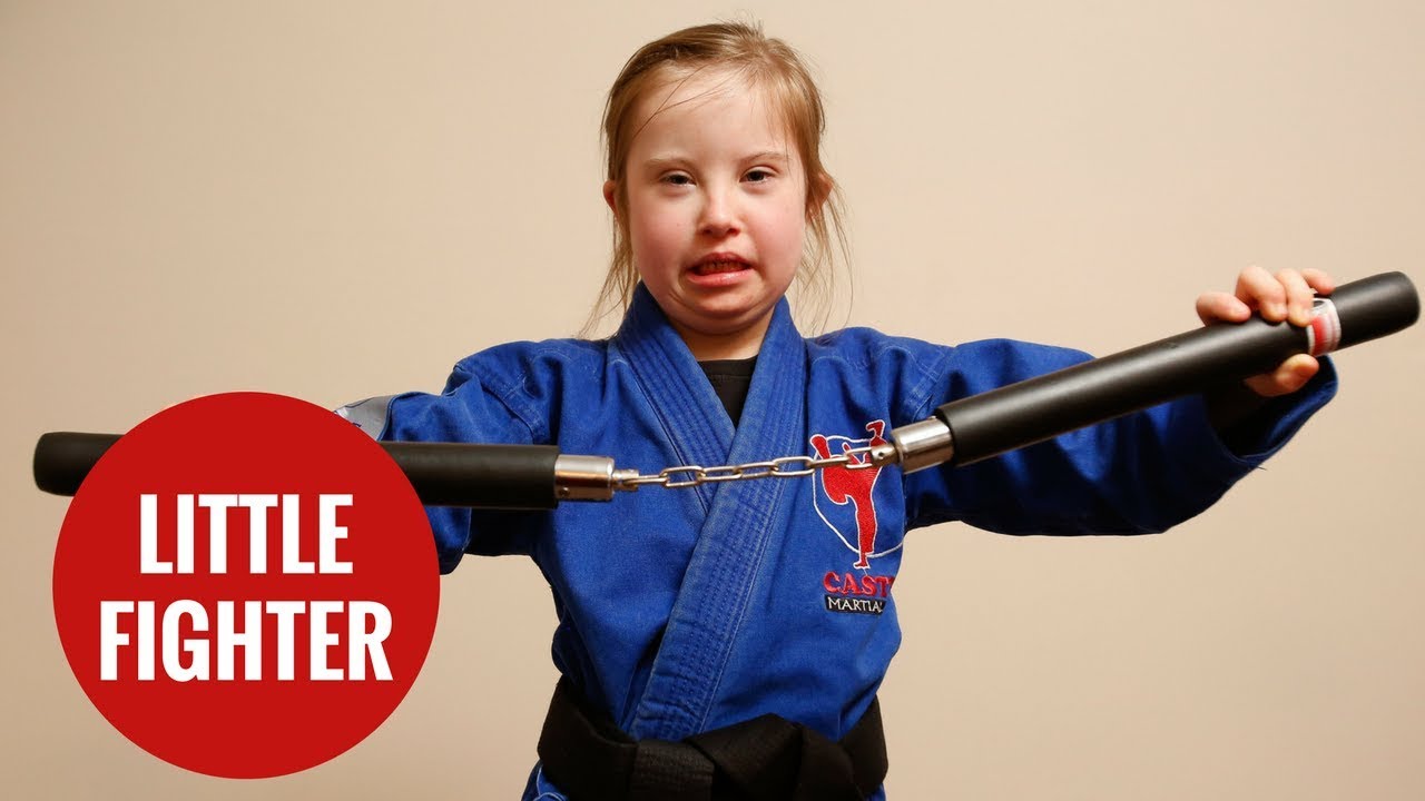 Eight-year-old with Down's Syndrome receives black belt in MMA