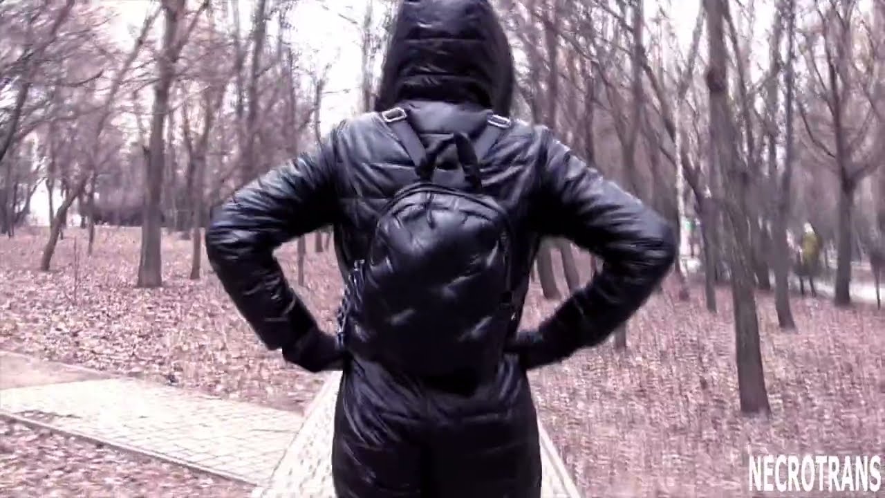 BLACK GLOSSY WARM SKI SUIT (SOLID WINTER SUIT) WITH HOOD AND MASK WITH RESPIRATOR AND GLASSES.