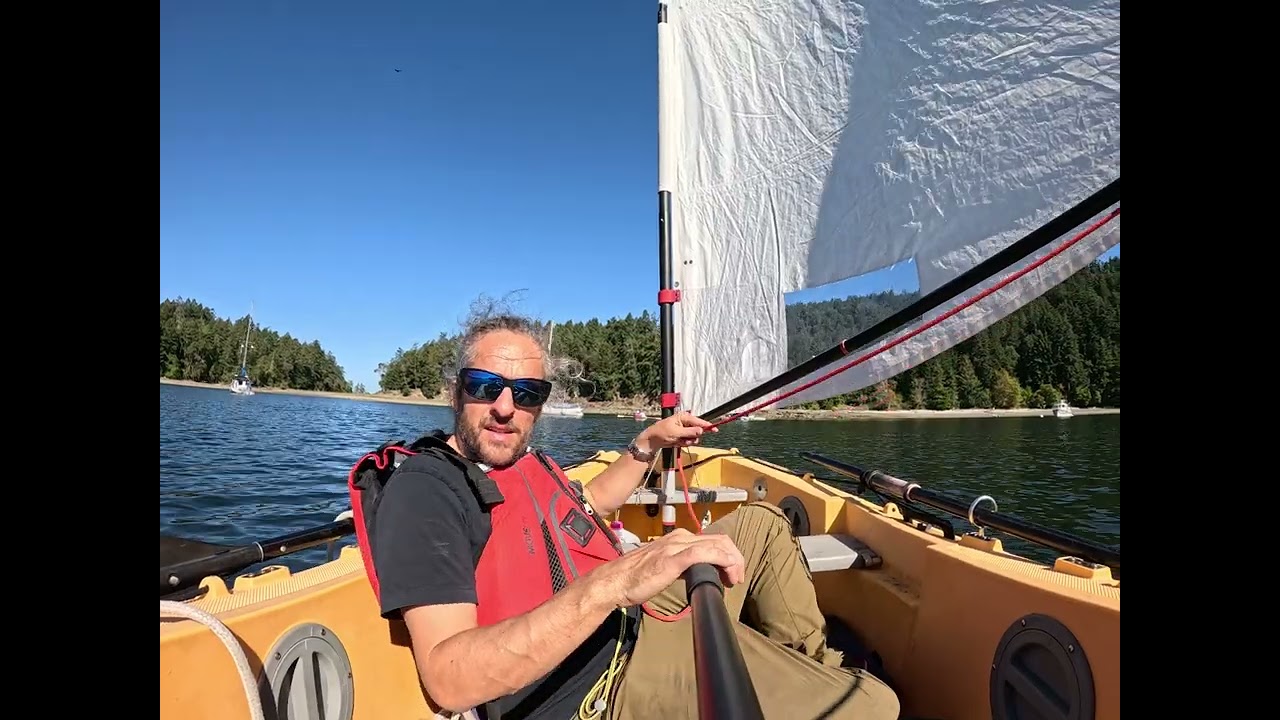 Dinghy sailing Portland Pudgy in Montague Harbour, British Columbia, Canada