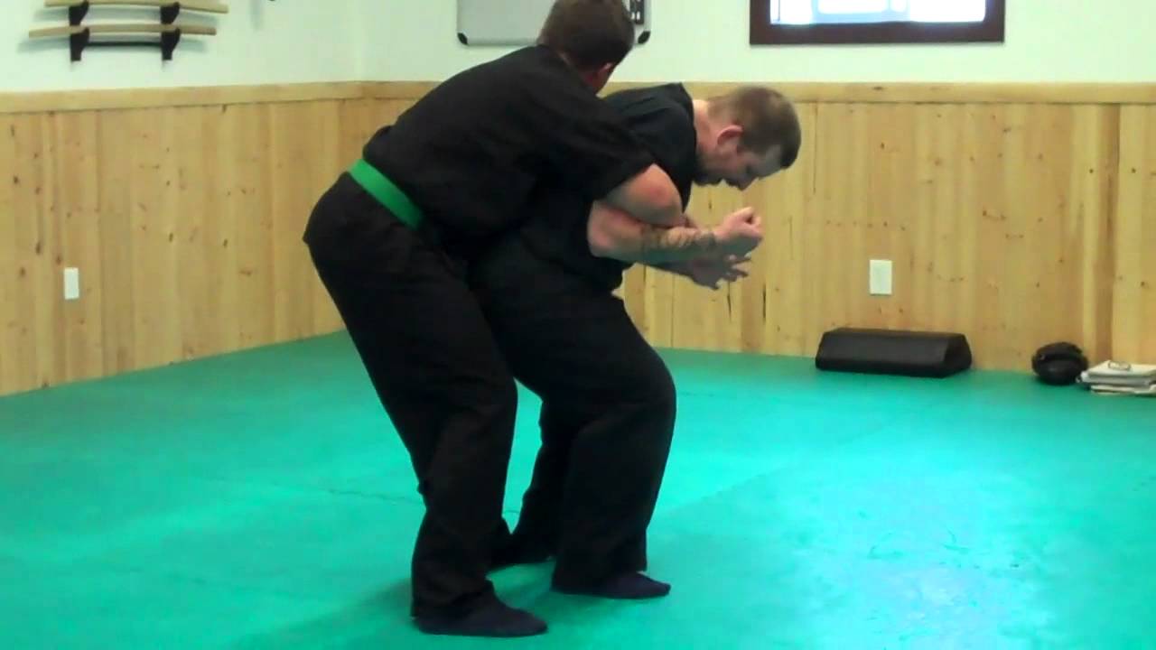 Combatives defense from rear attack
