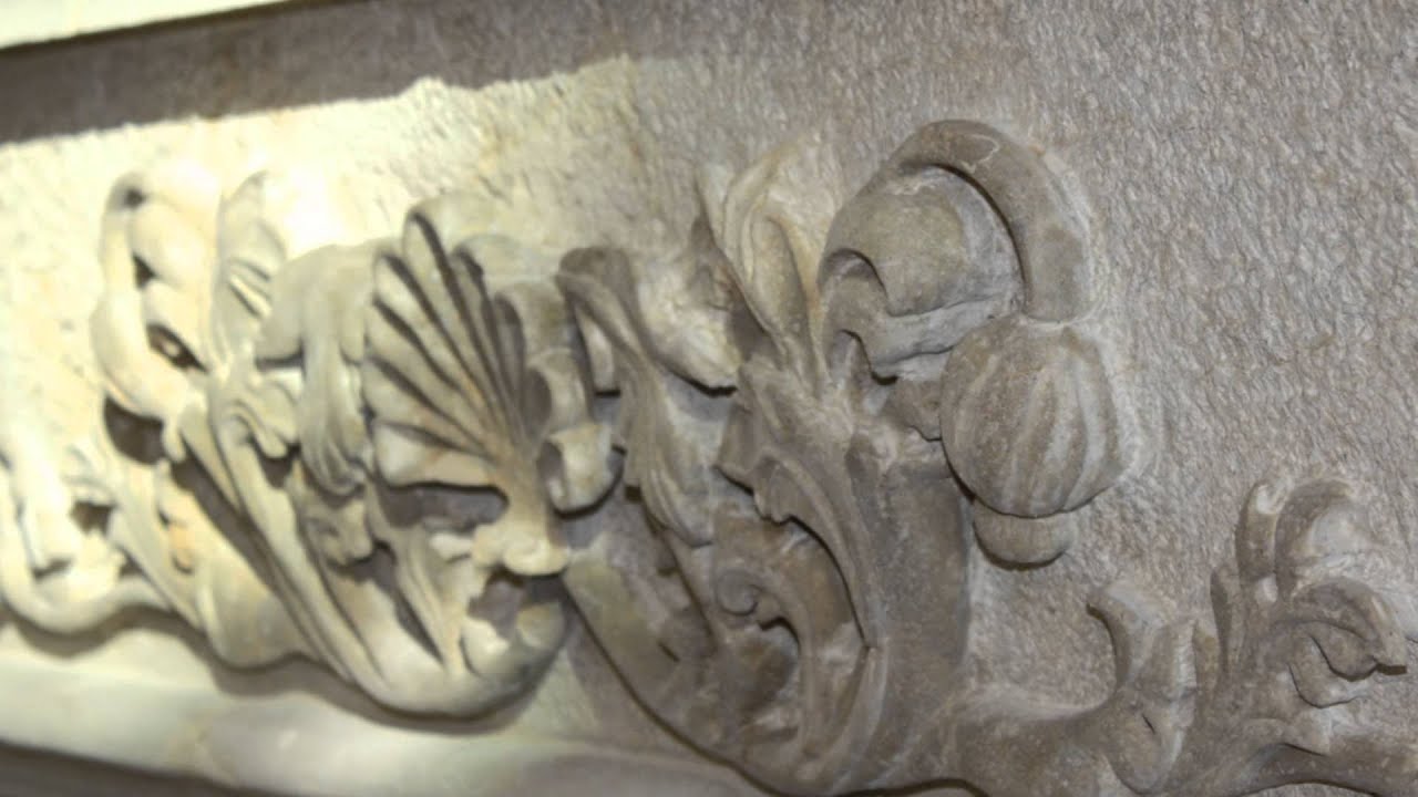 Custom Stone Fireplace using Curving Technique to Hand Carve Natural Stone in Sarasota, FL