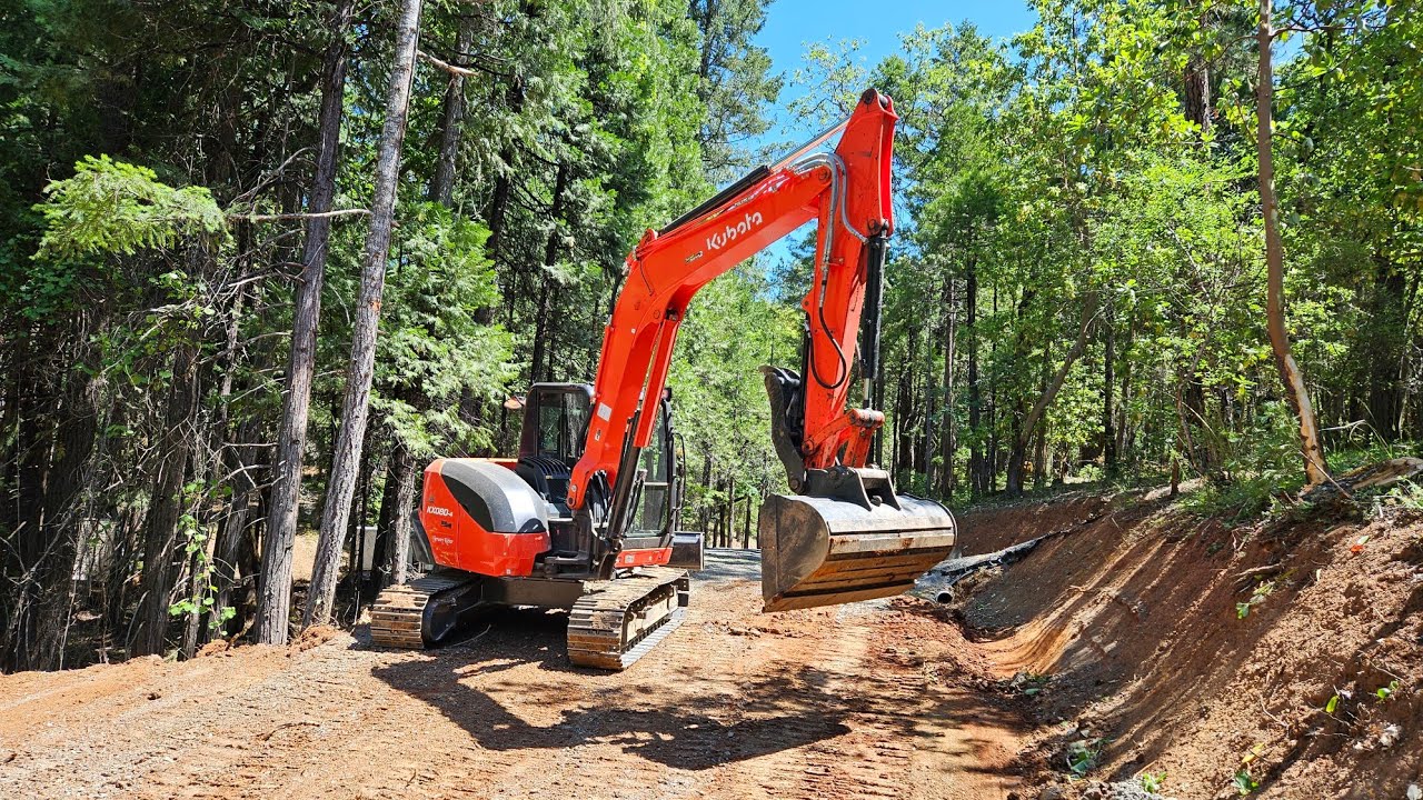 Tree pushing and road changing with the Kubota 080 4