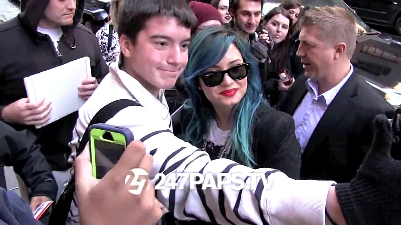 Demi Lovato arriving at the Katie Couric Show with Blue Hair