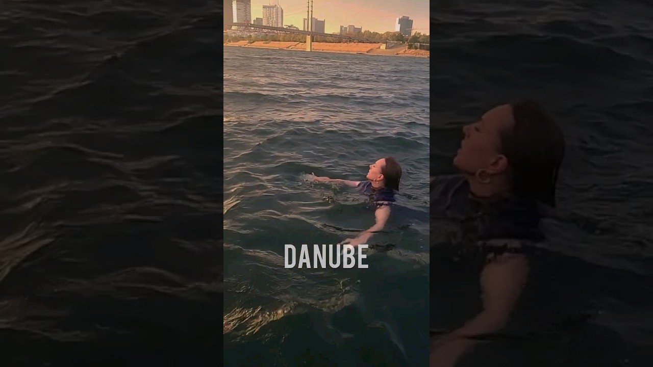 Fully clothed swimming in Danube www.enneproduction.com