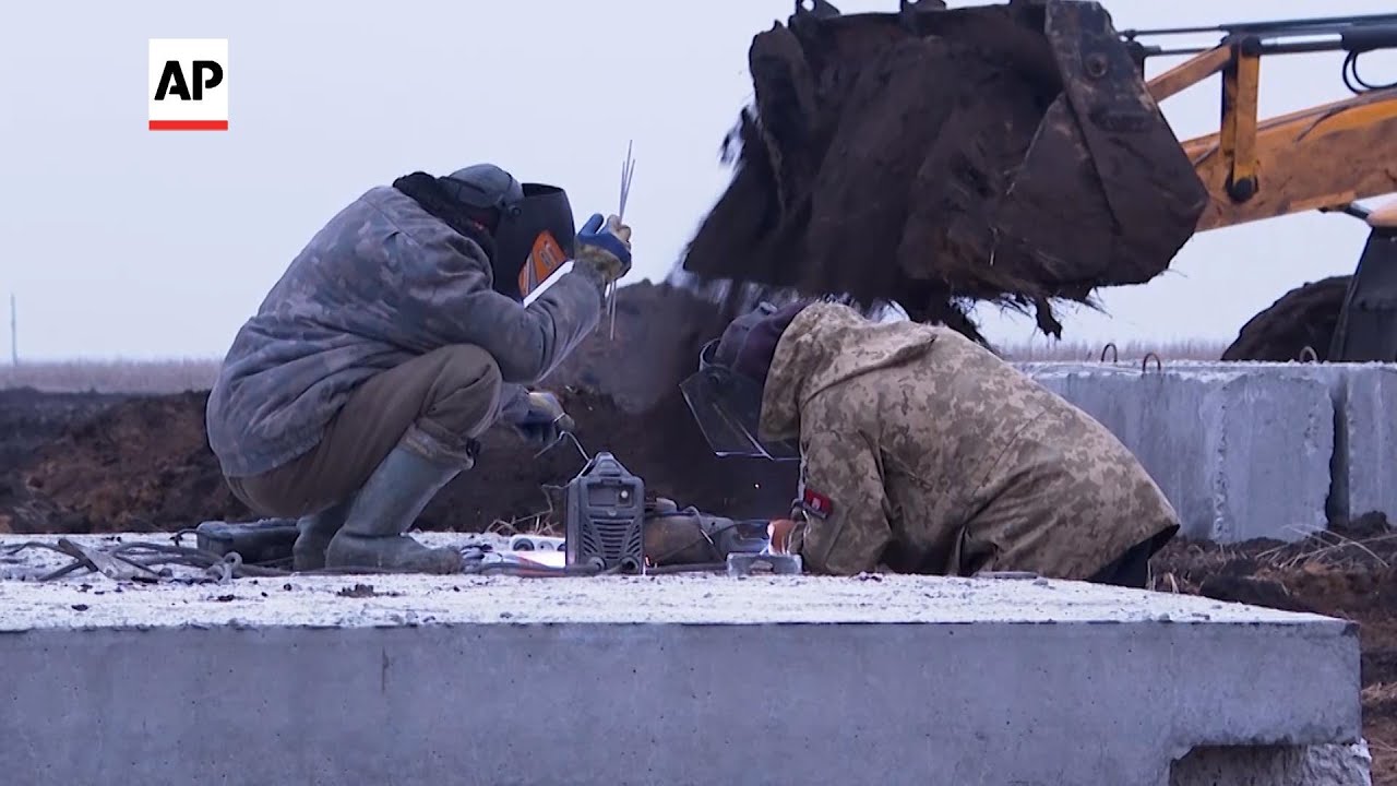 Ukrainians are digging trenches as part of defense in Kharkiv