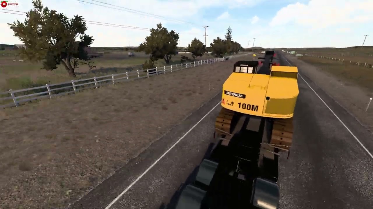 Rudas 362 with rogers lowboy hauling a Old Caterpillar 551 Feller Buncher