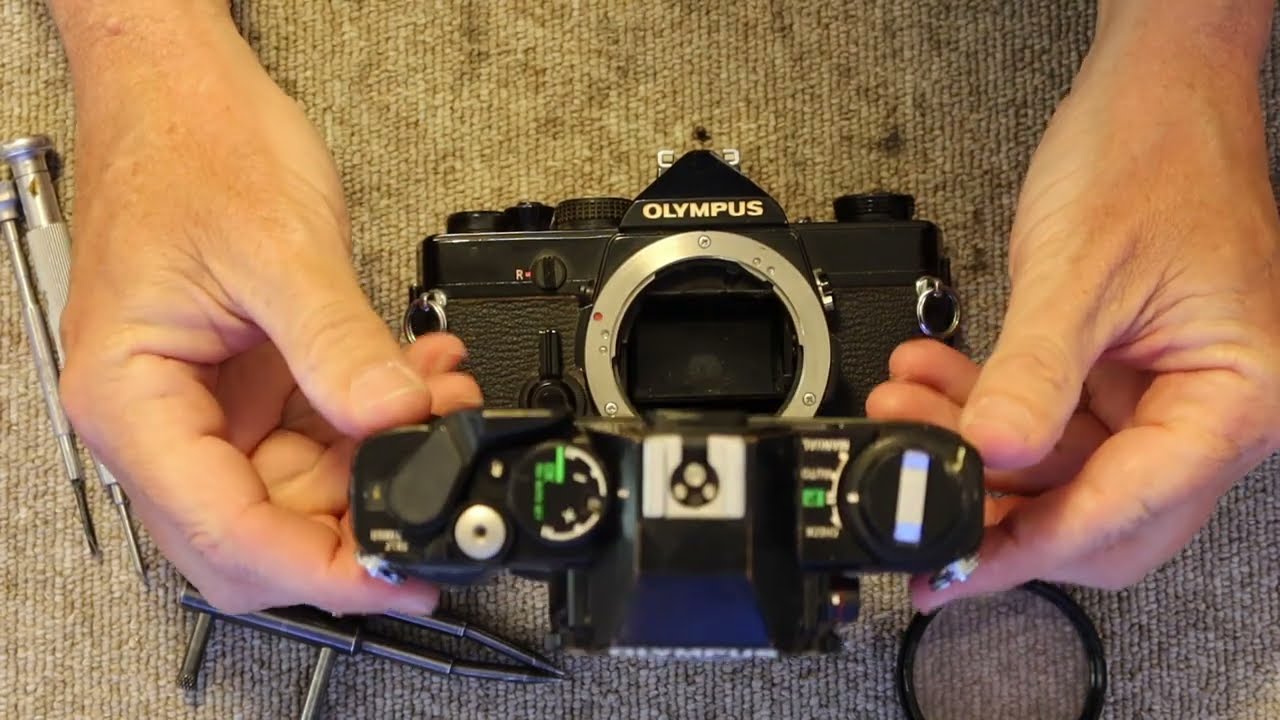 How to replace the prism in an Olympus OM-1 Camera