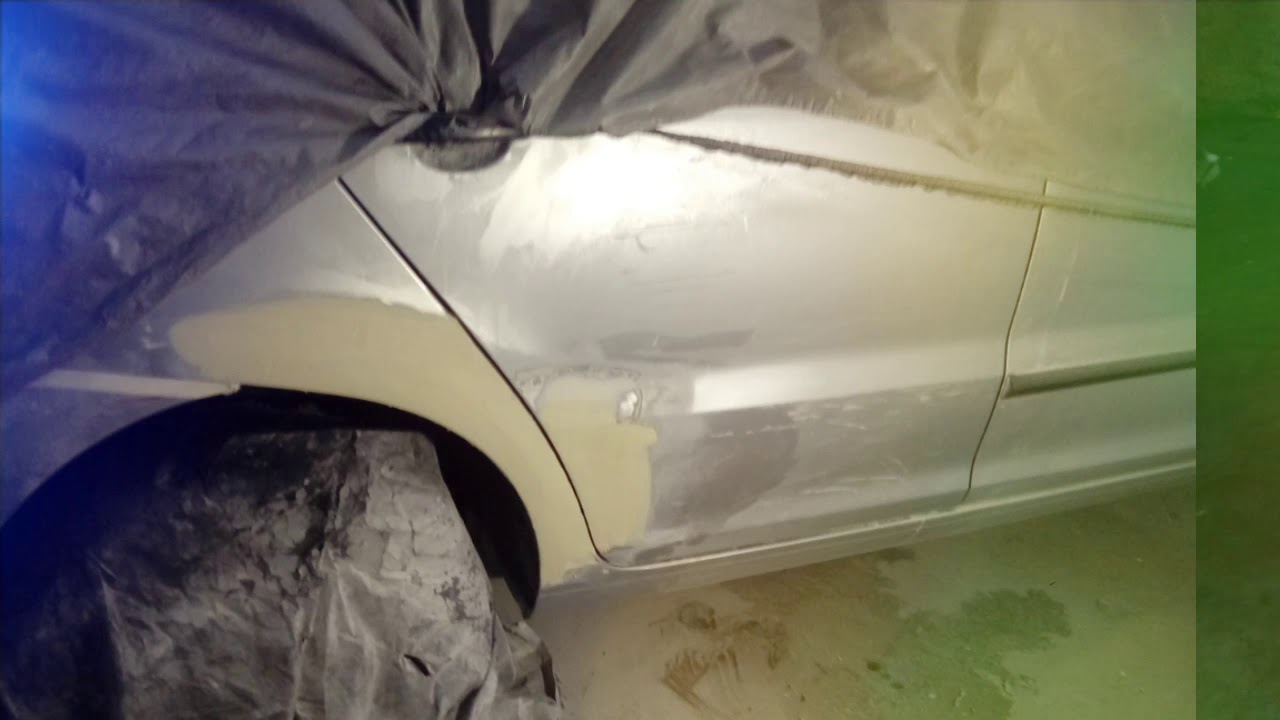 Reparo e retoque pintura na lateral carro fox prata.