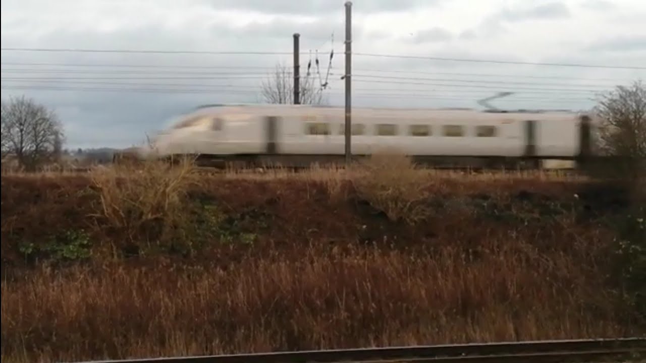 802219 passing Longlands Junction on 9E13